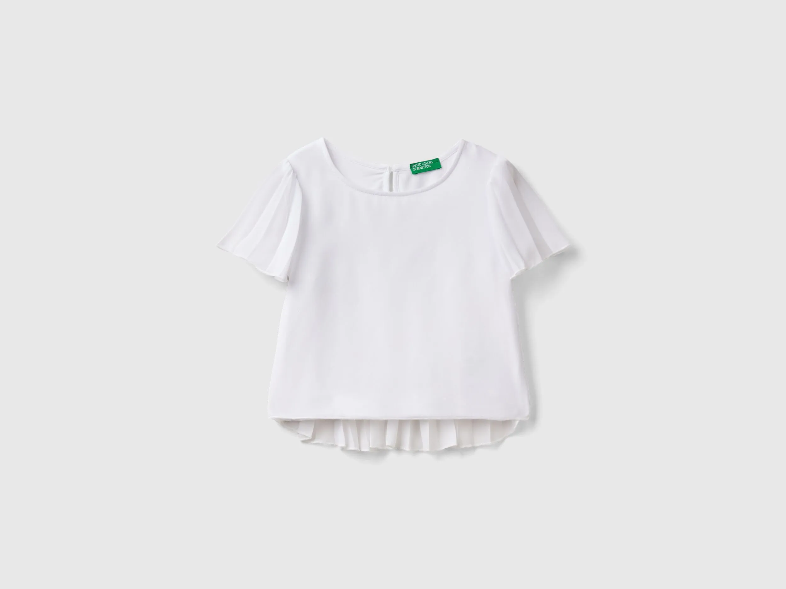 Blusa con detalles plisados