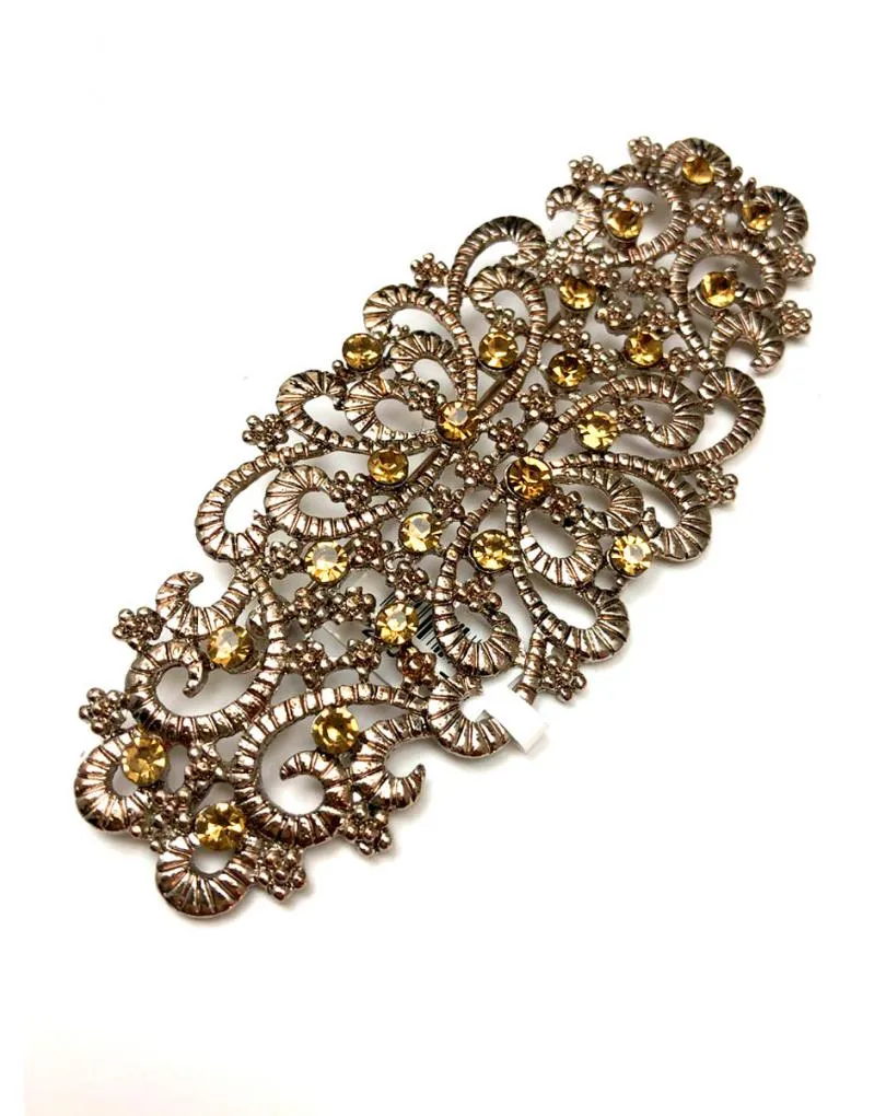 BROCHES MUJER EN TONO COBRE CON DETALLES EN CRISTAL