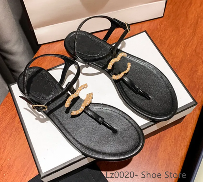 Diseñador de moda francés Zapatillas de mujer Zapatos planos con punta abierta Verano T Atar Zapatos de marca para mujer Playa C