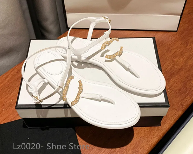 Diseñador de moda francés Zapatillas de mujer Zapatos planos con punta abierta Verano T Atar Zapatos de marca para mujer Playa C