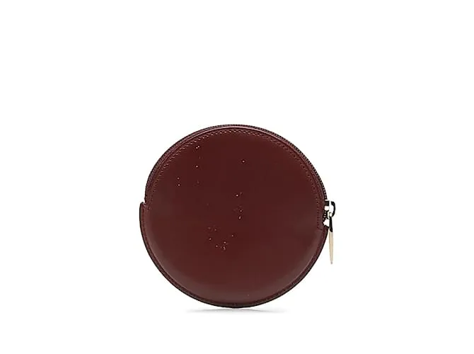 Estuche redondo de cuero rojo vino de la línea Must de Cartier en muy buen estado Roja 