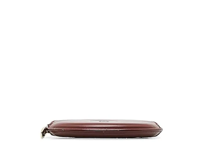 Estuche redondo de cuero rojo vino de la línea Must de Cartier en muy buen estado Roja 